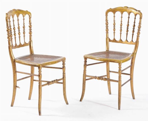A pair of gilt wood chairs, 20th century