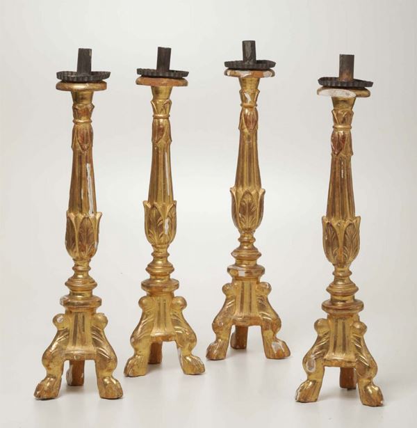 Quattro candelieri in legno intagliato e dorato, XIX-XX secolo