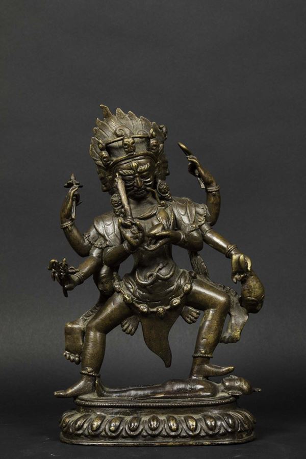 A burnished bronze figure of Yama on a lotus flower, Tibet, 18th century
