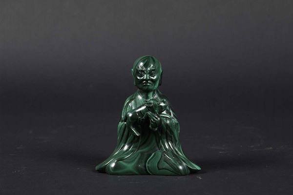 A malachite figure of a wiseman with a small dragon, China, early 20th century