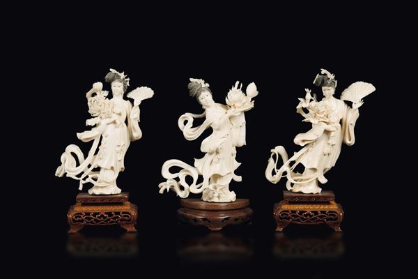 Three carved ivory Guanyin figures holding fans, China, Republic, early 20th century