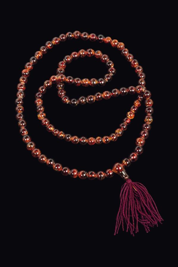 Ornamental prayer beads with amber spheres, China, Qing Dynasty, 19th century