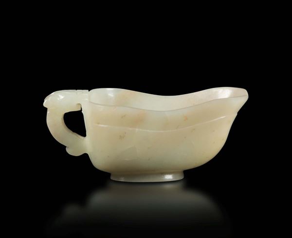 A white jade cup with a dragon head handle, China, Qing Dynasty, 19th century