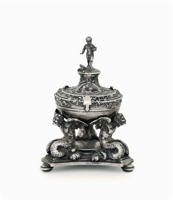 A molten and chiselled inkwell. Silversmith M. Mosini, Milan first half of the 19th century