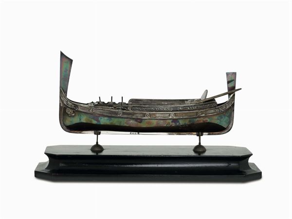 A model of a Maltese skiff in molten, embossed and chiselled silver, Italy, 20th century