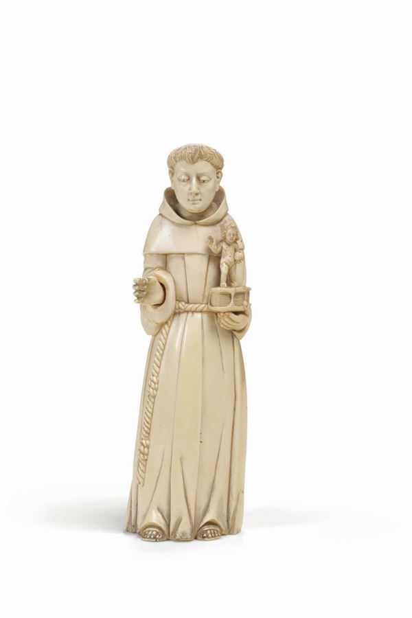 A large ivory figure depicting Saint Dominic holding a sacred text and a Child Salvador Mundi Christ. Indo-portuguese, Goa, 18th century