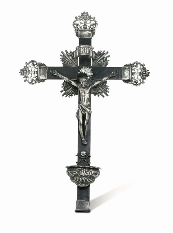 An unusual Crucifix / Holy water fount in molten, embossed and chiselled silver and ebonised wood, Genoa 18th century