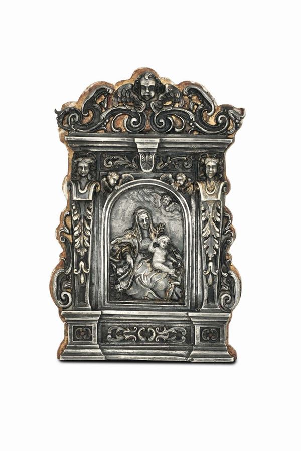 A pax in molten, embossed, perforated and chiselled silver, wooden mounting. Baroque Italian silver work (Veneto?) from the 17th century (apparently free of stamps)