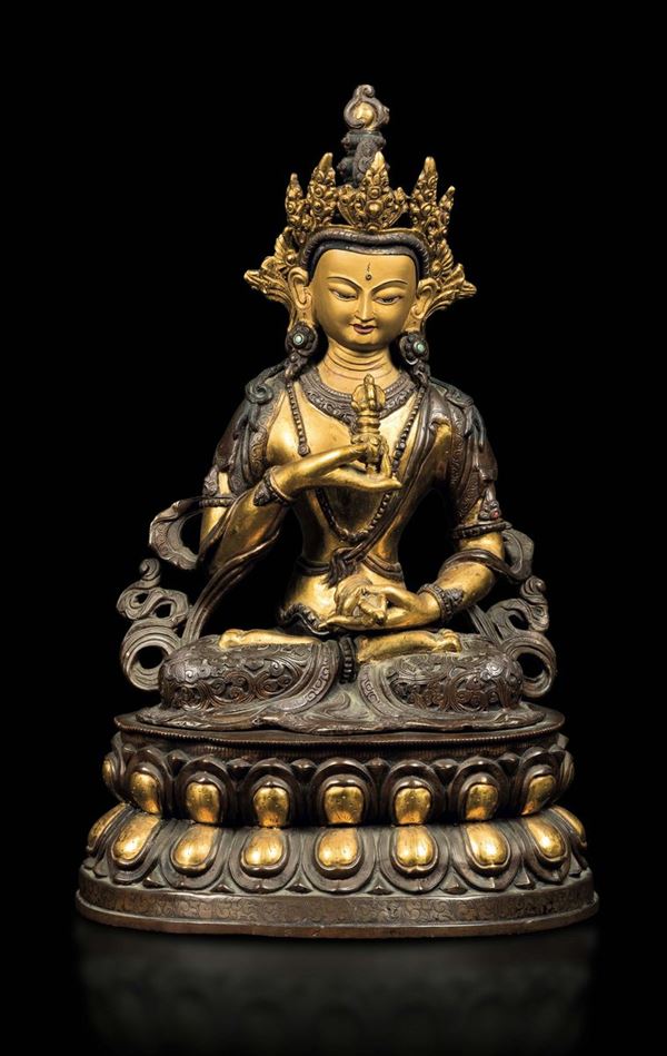 A gilt and burnished bronze figure of Amitayus seated on a double lotus flower holding ritual items, Tibet, 19th century