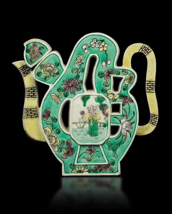 A glazed porcelain teapot in the shape of an ideogram with figures of a wiseman and children, China, Qing Dynasty, Kangxi period (1622-1722)