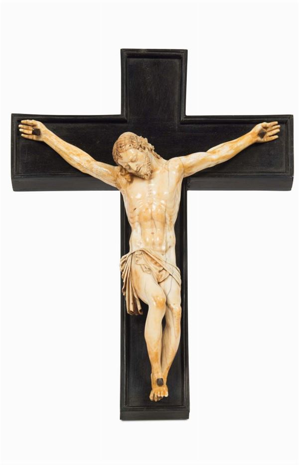 An ivory Corpus Christi on an ebony cross. Sculptor active in Italy in the 16th - 17th century