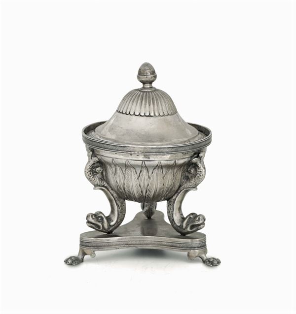 A sugar bowl in molten, embossed and chiselled silver. Genoa (?), 19th century. Unidentified stamps