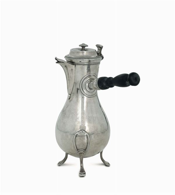 A molten, embossed and chiselled first-title silver coffee pot with a turned and ebonised wood handle. France, early 19th century