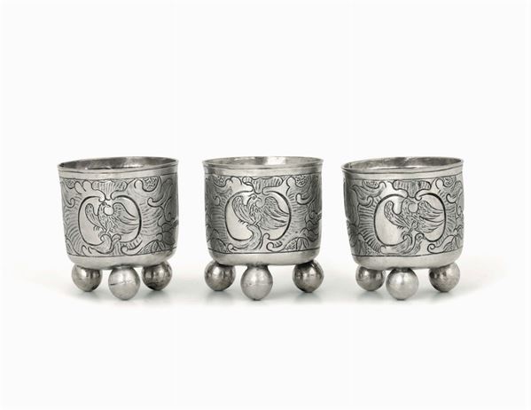 A set of three containers in embossed and chiselled silver with zoomorphic and botanical motives. Germany or Russia, 18th-19th cecntury, apparently free of marks