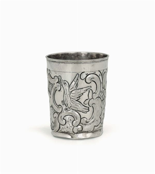 A glass in embossed and chiselled silver with a spiral and zoomorphic decor. Moscow 1779