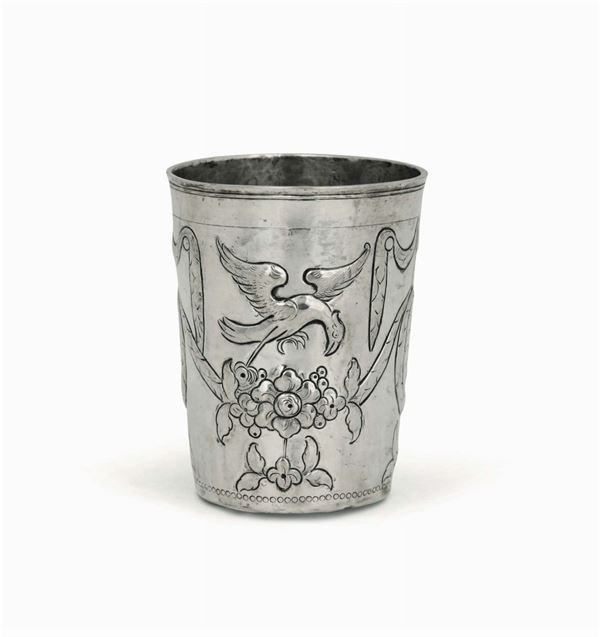 A glass in embossed and chiselled silver with a festoon, zoomorphic and floral decor. Moscow 18th-19th century