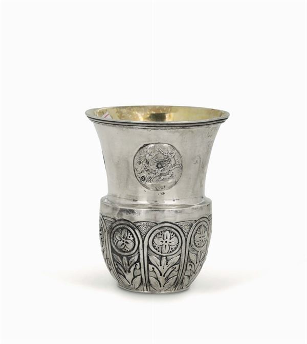 A vase-shaped glass in embossed and chiselled silver. Moscow 1838