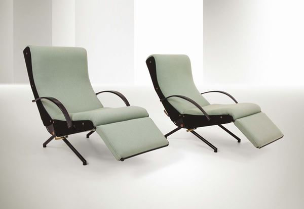 Osvaldo Borsani, a pair of P40 armchairs with steel structures, lacquered metal bases and fabric upholstery. Rubber armrests with brass details. Tecno Prod., Italy, 1950