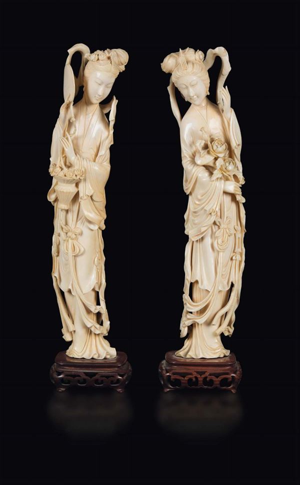 Two carved ivory figures of Guanyin with flowers, China, early 20th century