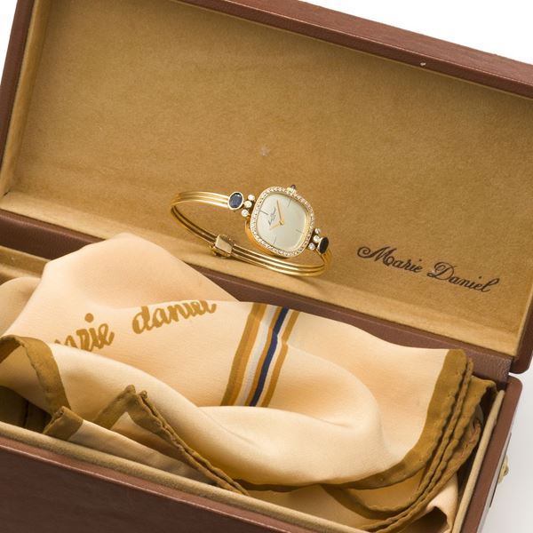Lady's yellow gold, diamond and sapphire bangle watch