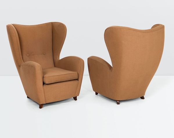 A pair of armchairs with a wooden structure and fabric upholstery. Italy, 1950 ca.