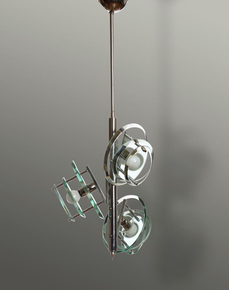 Lampada a sospensione con struttura in metallo ed elementi diffusori in vetro molato.  - Auction Design - Cambi Casa d'Aste