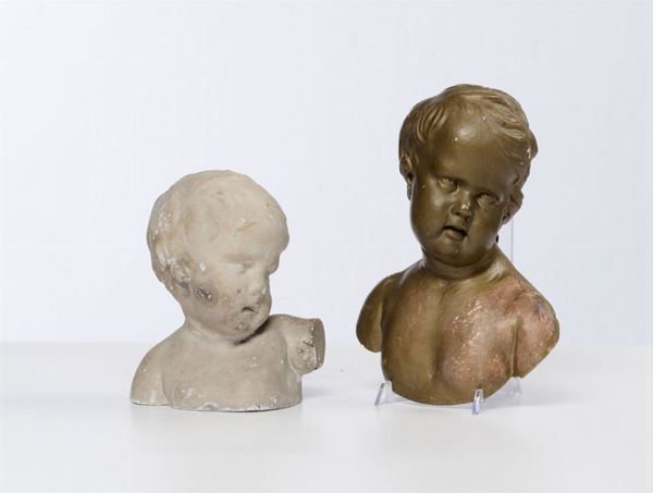 Lotto composto da due busti di putti, uno il legno intagliato l’altro in gesso, da un prototipo di Francois Duquesnoy