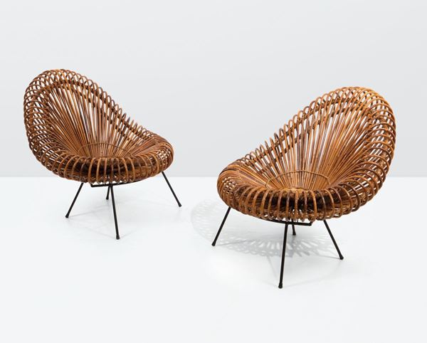 Janine Abraham and Dirk Jan Rol, a pair of rattan armchairs with lacquered metal stands. Edition Rougier Prod., The Netherlands, 1950 ca.