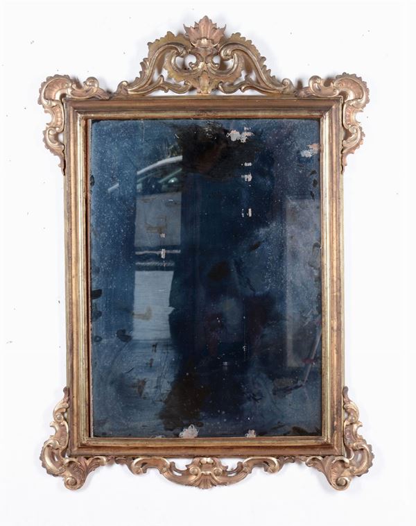 Specchiera di gusto Luigi XIV intagliata e dorata, XIX secolo