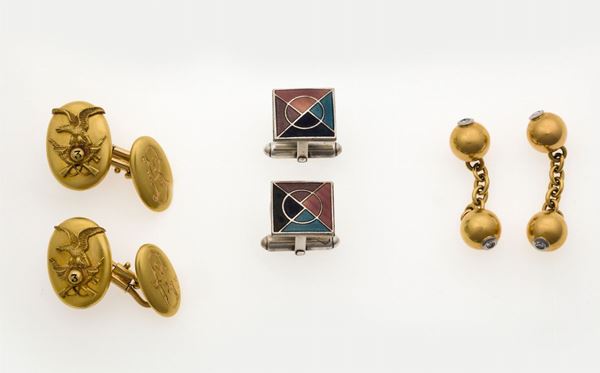 Two pair of gold cufflinks and a pair of silver cufflinks