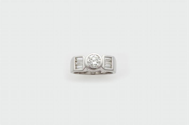 Anello con diamante di taglio brillante di circa ct 0,55 e sei diamanti di taglio a baguette  - Asta Fine Jewels - Cambi Casa d'Aste