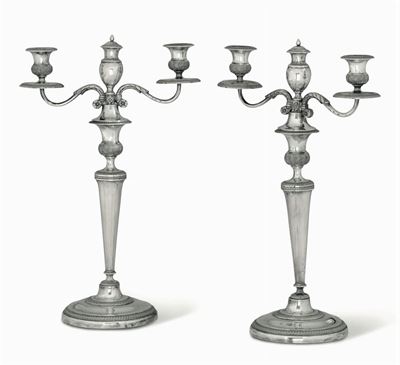 Coppia di Candelabri a Due Fiamme in Argento Sbalzato e Cesellato. Genova, XIX Secolo. Bolli di G...