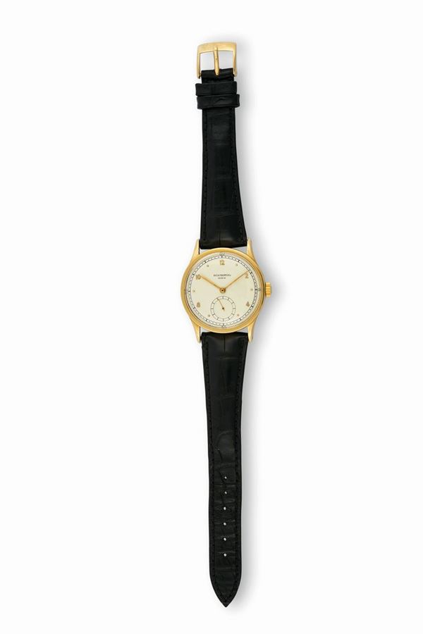 PATEK PHILIPPE, Geneve, Ref. 570. Raro, orologio da polso, in oro giallo 18K. Accompagnato dall'Estratto degli Archivi. Realizzato nel 1946