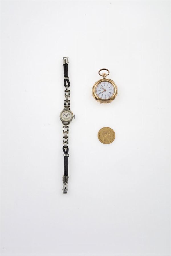 Lotto composto da orologio da polso, orologio da tasca ed una moneta