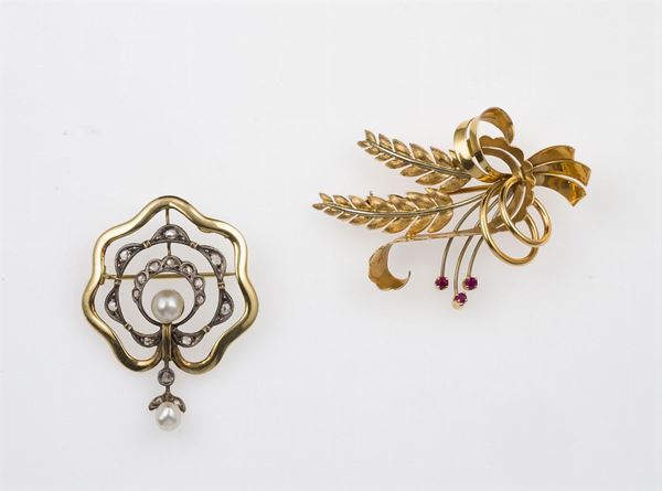 Two gold, silver and gem-set brooches