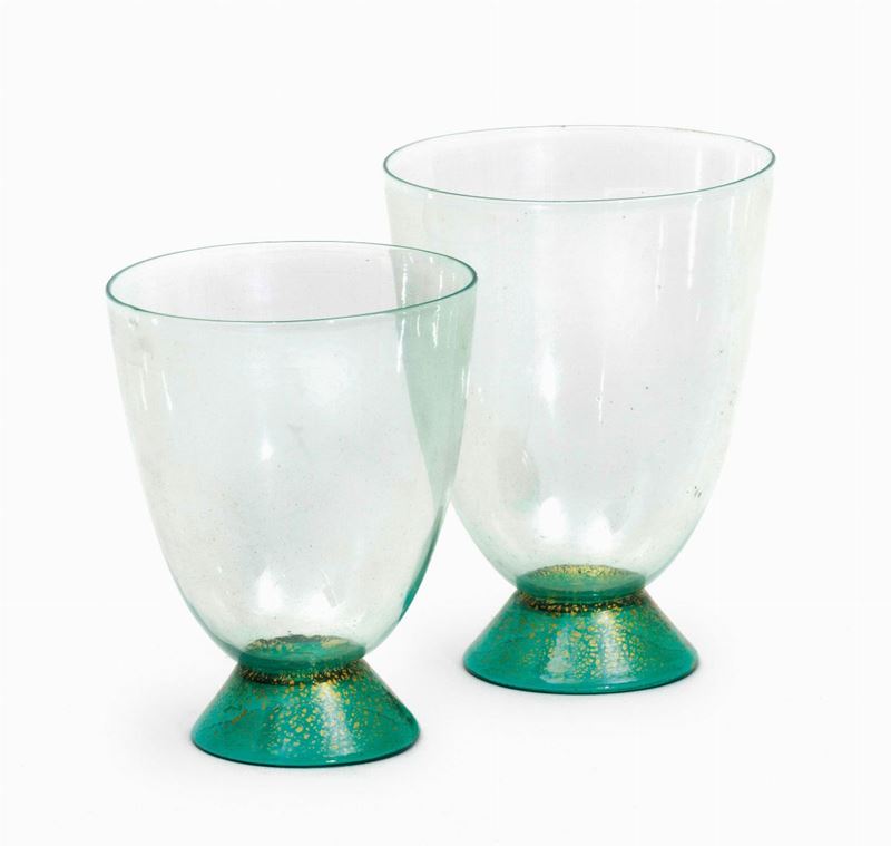 Carlo Scarpa, M.V.MTwo green blown glass drinking glasses with a gold leaf decor. H 10cm, diameter 7.5cm; H 9cm, diameter 7cm. Cappellin, Murano, 1930 ca  - Auction Murano '900 - Cambi Casa d'Aste