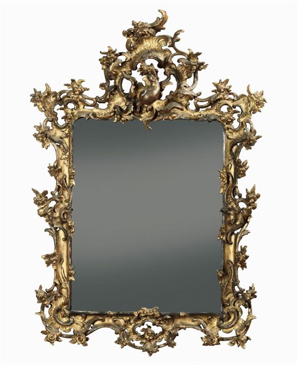 A carved and gilt wood mirror, 1700s