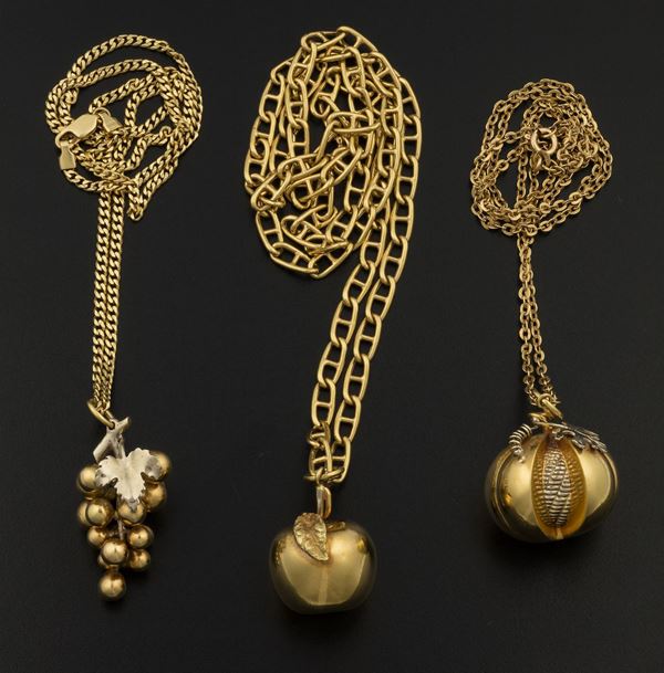 Three gold pendants