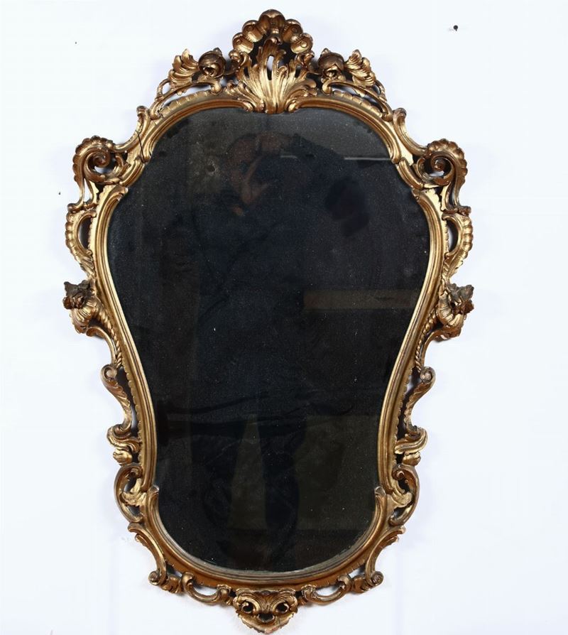 Specchiera in legno intagliato e dorato, XX secolo  - Asta Antiquariato Luglio | Cambi Time - Cambi Casa d'Aste