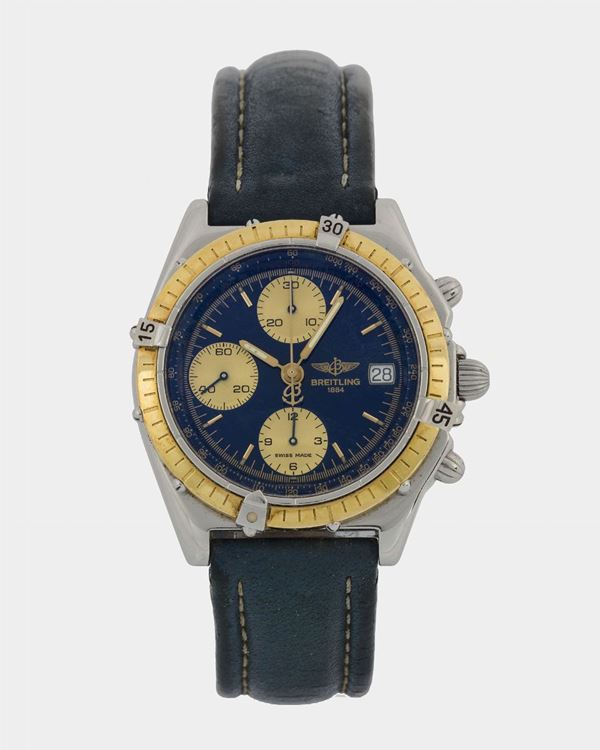Breitling, Chronomat, Ref. D13050. Fine, self-winding, water-resistant, stainless steel and 18K yellow gold  wristwatch with date, round button chronograph, registers, tachometer and a stainless steel Breitling buckle. Made circa 1990.