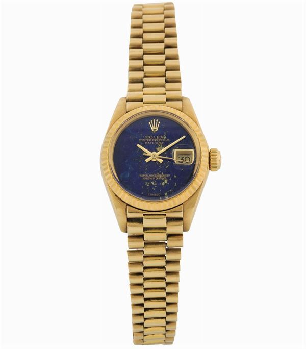 Rolex, Oyster Perpetual, Datejust, Superlative Chronometer Officially Certified, Ref. 6917.  Fine, tonneau-shaped, water-resistant, center-seconds, self-winding, 18K yellow gold lady's wristwatch with date, and an 18K yellow gold Rolex bracelet. Made in the 1980's.