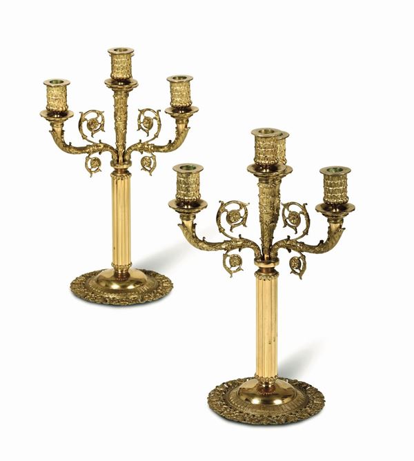 Coppia di candelabri in bronzo dorato a 4 fuochi stile Impero