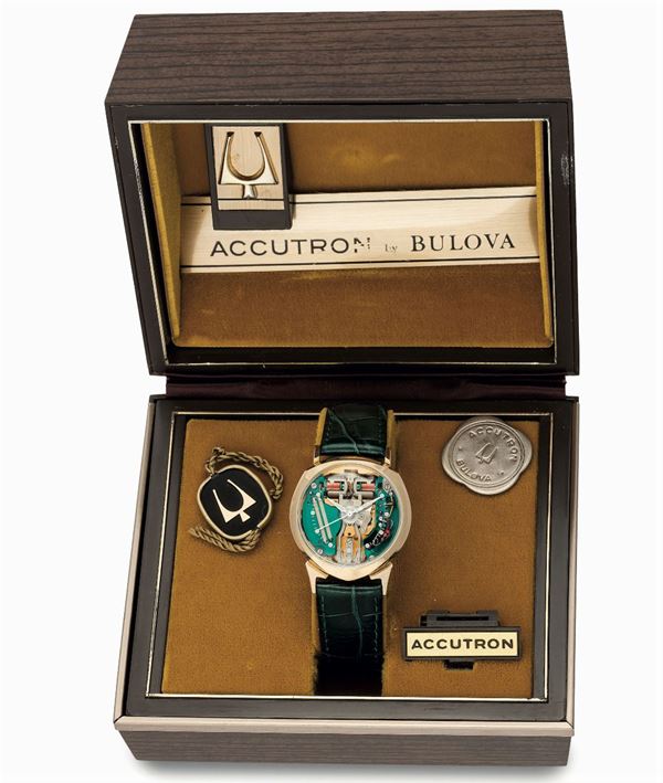 Bulova, Accutron, Space,  case No.D19059-M1.  Fine and rare, asymmetrical, electronic, center-seconds, water-resistant, 14K yellow gold wristwatch. Accompanied by the original box, hang tag and battery