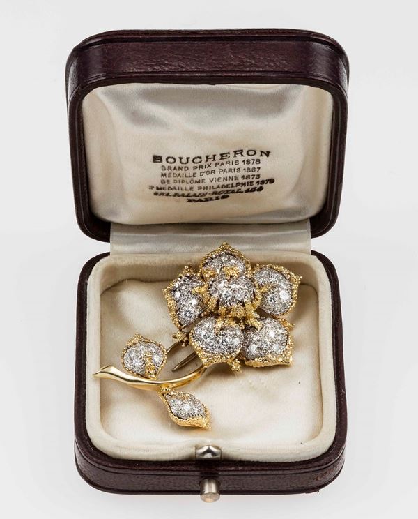 Diamond and gold brooch. Signed and numbered Boucheron Paris 12.936. Fitted case