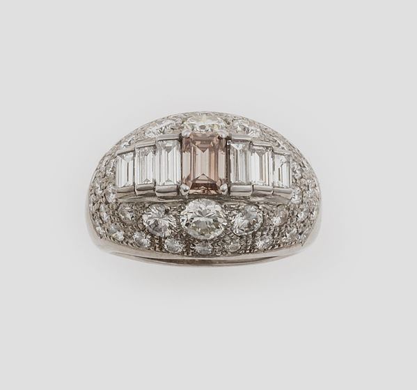 A fancy pink diamond ring. Signed Bulgari
