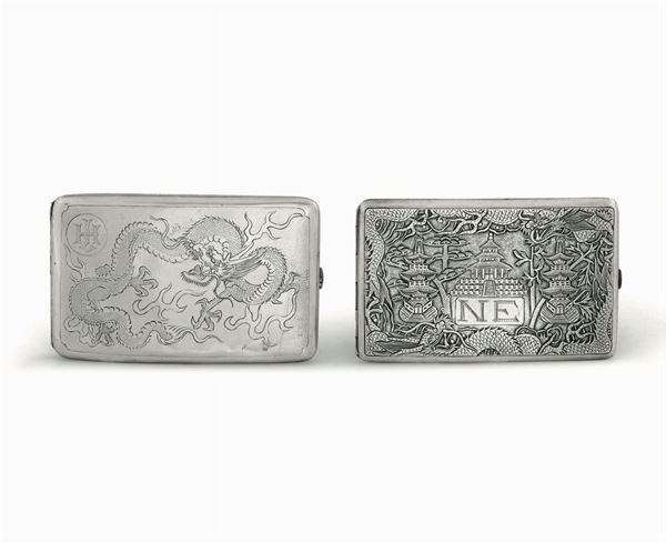 Due portasigarette in argento fuso e cesellato. Cina XX secolo