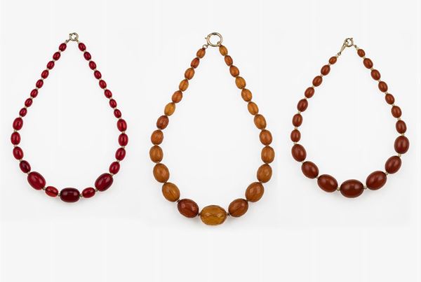 Three amber and resin necklaces