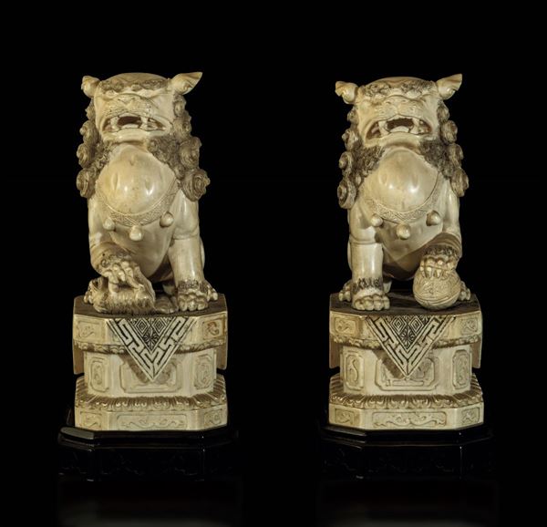 Two ivory Pho dogs, China, early 20th century