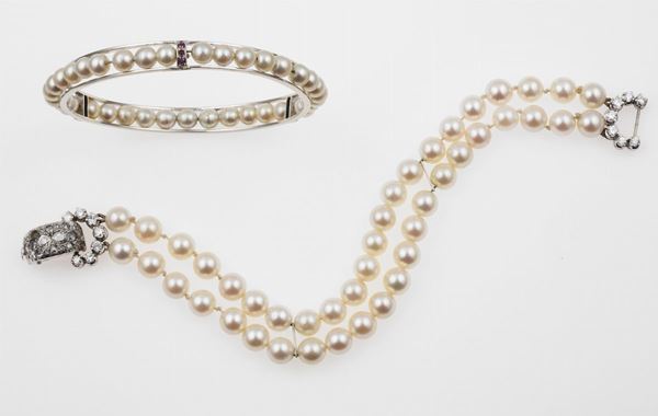 Two cultured pearls and gold bracelets