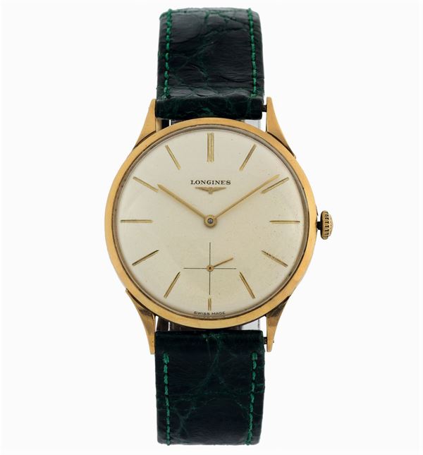 Longines. Fine, 18K yellow god wristwatch with original buckle. Accompanied by the original box. Made circa 1960